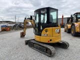 2021 Caterpillar 303.5E2 mini excavator, rear three-quarter view