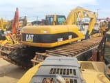 2010 Caterpillar 320C amphibious excavator, rear three-quarter view