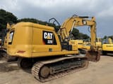 2018 Caterpillar 320 crawler excavator, rear three-quarter view