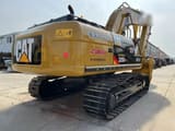 2012 Caterpillar 325DL crawler excavator, rear three-quarter view