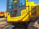 2023 Komatsu PC138US crawler excavator, side view of cab