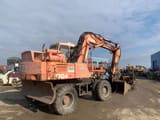 1993 Atlas 1304 wheel excavator, rear three-quarter view