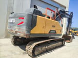 2016 Volvo EC220ENL crawler excavator, rear three-quarter view