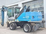 2016 Fuchs MHL320D material handler, side view