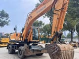 2022 Hyundai R210W-9 wheel excavator, front three-quarter view