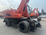 2022 Doosan DH210W wheel excavator, rear three-quarter view