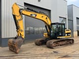 2011 Caterpillar 319DL crawler excavator, side view