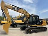 2009 Caterpillar 323DL crawler excavator, side view