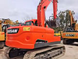 Doosan DX140LC-9C crawler excavator, rear three-quarter view