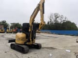 2022 Caterpillar 303.5E mini excavator, rear three-quarter view