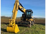 2009 Caterpillar M322D wheel excavator, front three-quarter view