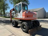 2001 Atlas 1004 M wheel excavator, rear three-quarter view