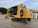 2016 Caterpillar 312E crawler excavator, rear three-quarter view
