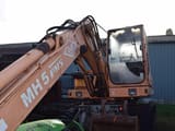 1990 O&K MH 5 PMS wheel excavator, side view