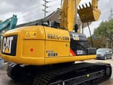 2022 Caterpillar 323DL crawler excavator, rear three-quarter view
