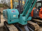 2024 Kobelco SK60-8 mini excavator, rear three-quarter view