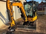 2023 Caterpillar 302.7CR mini excavator, front three-quarter view