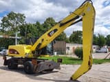 2011 Caterpillar M318D MH material handler, side view