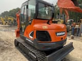 2020 Doosan DX60-9C crawler excavator, rear three-quarter view