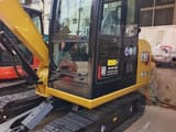 2024 Caterpillar 305.5E2 mini excavator, side view