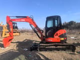 2022 Kubota U55-4 mini excavator, side profile view
