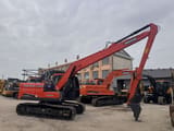 2018 Doosan DX140LC crawler excavator, side view with long-reach boom