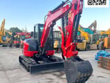 2023 Kubota KX057-4 mini excavator, front three-quarter view