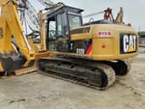 2020 Caterpillar 312D excavator, rear three-quarter view