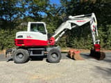 2015 Takeuchi TB295W wheel excavator side view