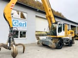 2011 Liebherr A934C material handler, side view with grapple