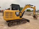 2022 Caterpillar 305.5E2 excavator, side view