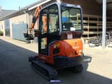 2015 Kubota KX019-4 mini excavator, rear three-quarter view