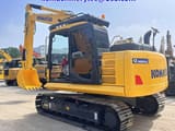 2024 Komatsu PC200 crawler excavator, rear three-quarter view