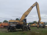 2005 Caterpillar M325C LMH material handler side view