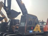 2023 Volvo EC140 crawler excavator, front three-quarter view
