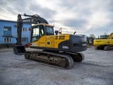 2009 Volvo EC210CNL crawler excavator, rear three-quarter view