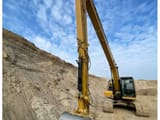 2022 Caterpillar 320 crawler excavator, front three-quarter view