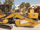 2023 Caterpillar 320GC crawler excavator, side view