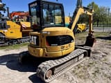 2007 Caterpillar 304CCR mini excavator, rear three-quarter view