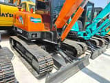 2024 Doosan DH55 mini excavator, front three-quarter view