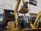 2024 Caterpillar 307E excavator, front three-quarter view