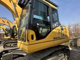 2023 Komatsu PC110-7 crawler excavator, side view of the cab