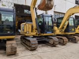 2024 Caterpillar 307E excavator, front three-quarter view