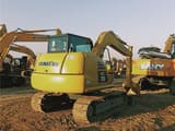 2024 Komatsu PC70-8 mini excavator, rear three-quarter view