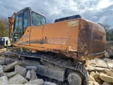 2005 CASE CX240 crawler excavator, rear three-quarter view
