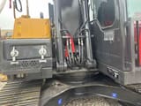 2022 Volvo EC140 crawler excavator side view of cab and boom base