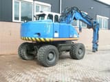 2002 Atlas 1404 wheel excavator rear three-quarter view