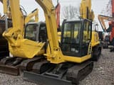 2022 Komatsu PC56-7 crawler excavator, front three-quarter view