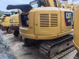 2024 Caterpillar 307E excavator rear view with engine compartment open