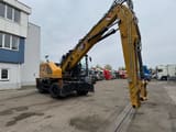 2022 Caterpillar MH3024 wheel excavator, side profile view